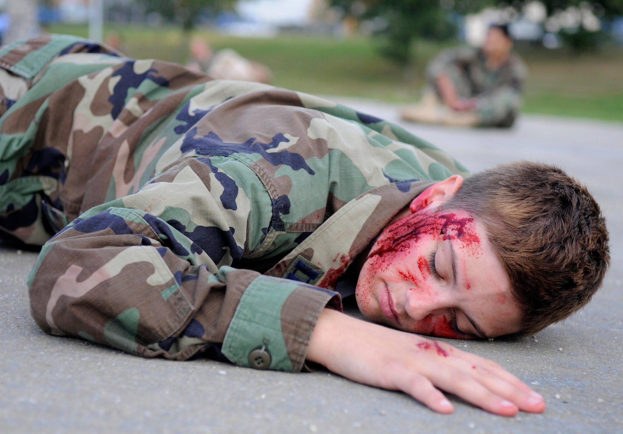 SPANGDAHLEM AIR BASE, Germany – Airman Charla Maddox, 52nd Security Forces Squadron, acts as an injured Airman during an all hazards response training emergency management and mass casualty exercise Oct. 7. All simulated casualties were instructed to act as real as possible to provide a suitable training environment for the responders. (U.S. Air Force photo/Airman 1st Class Staci Miller)