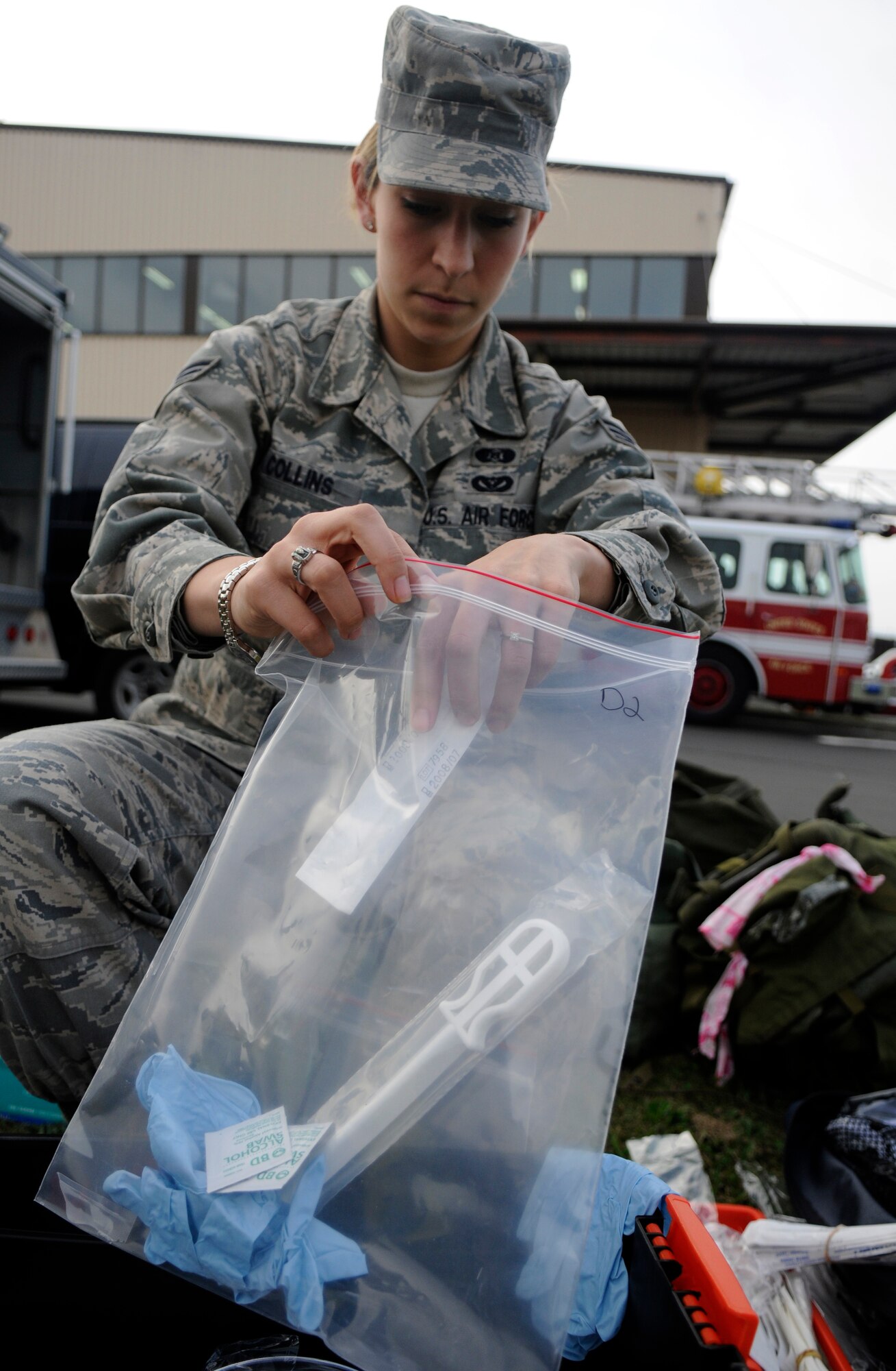 SPANGDAHLEM AIR BASE, Germany – Senior Airman Briana Collins, 52nd Civil Engineer Squadron, prepares specimen bags to use during an all hazards response training emergency management and mass casualty exercise Oct. 7. The specimen bags were later used to help identify what simulated chemical was released in the air. (U.S. Air Force photo/Airman 1st Class Staci Miller)
