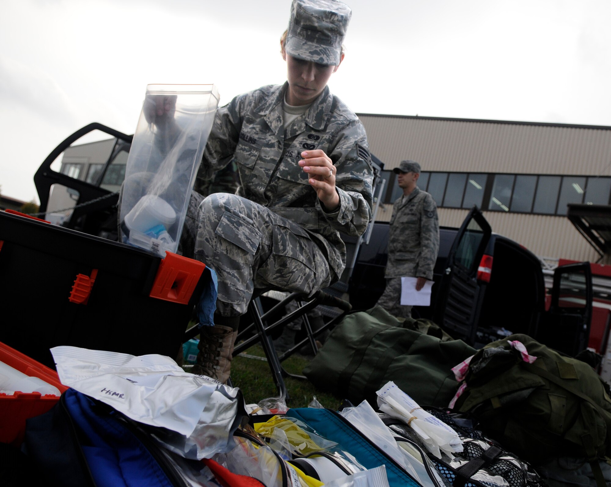 SPANGDAHLEM AIR BASE, Germany – Senior Airman Briana Collins, 52nd Civil Engineer Squadron, prepares specimen bags to use during an all hazards response training emergency management and mass casualty exercise Oct. 7. The specimen bags were later used to help identify what simulated chemical was released in the air. (U.S. Air Force photo/Airman 1st Class Staci Miller)