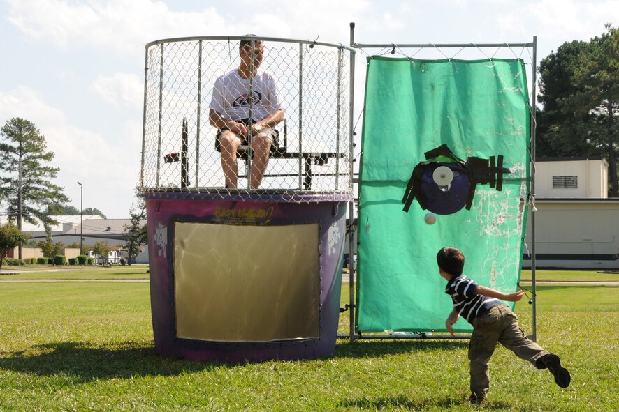Command Chief Master Sgt. Greg Nelson sits in the dunking booth at the 916th Air Refueling Wing Family Day held on Oct. 3. U.S. Air Force photo by TSgt. Gillian Albro, 916ARW/PA.