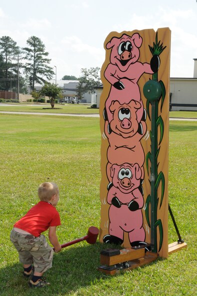 A family member plays one of the many games offered at the 916th Air Refueling Wing Family Day event held on Oct. 3. U.S. Air Force photo by TSgt. Gillian Albro, 916ARW/PA.