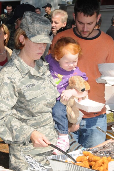 Members of the 916th Air Refueling Wing and their families enjoy the food at the Family Day Picnic Oct. 3.  (U.S. Air Force photo by Gillian M. Albro, 916th ARW/PA)