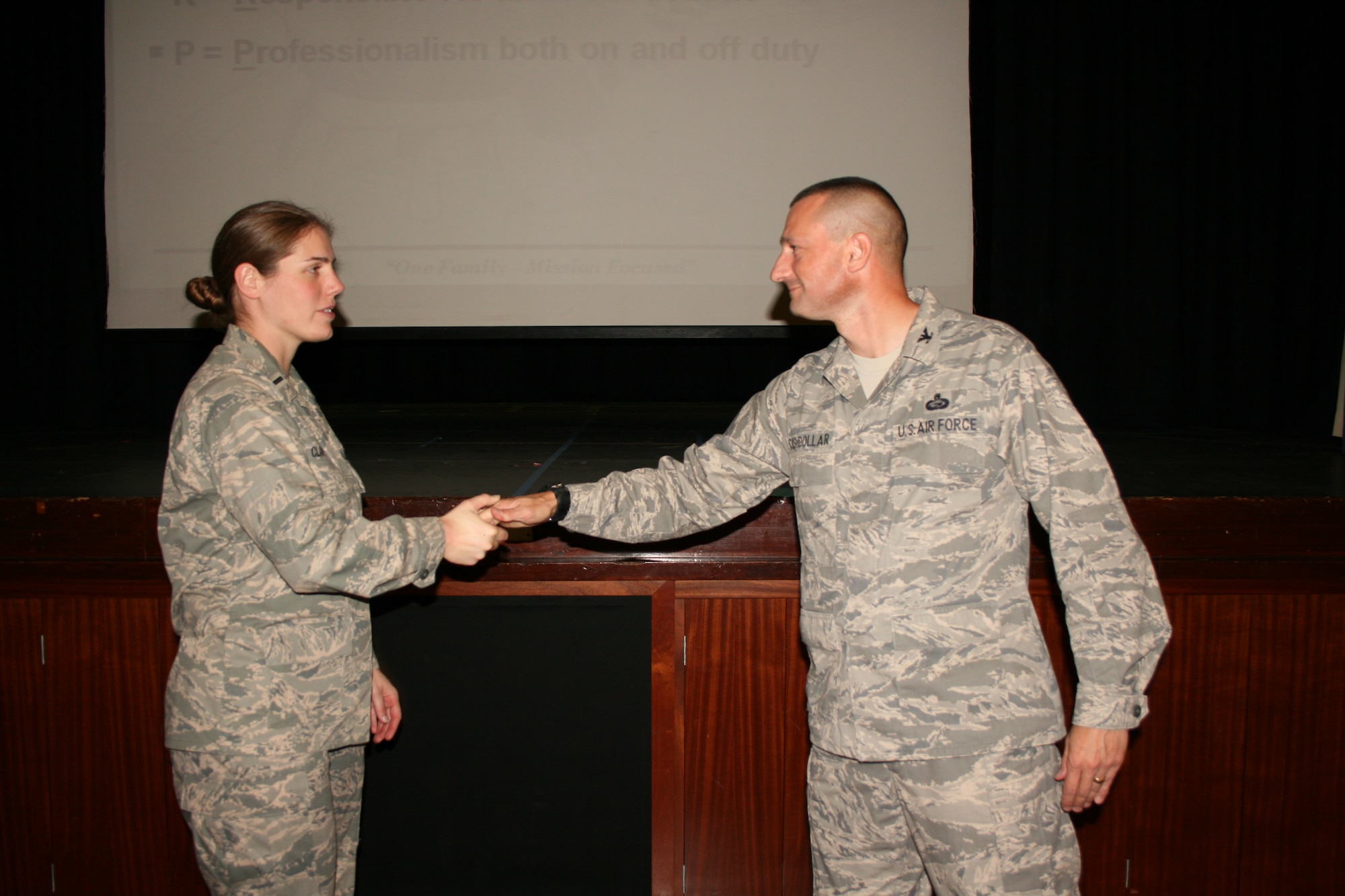 RAF CROUGHTON, United Kingdom - 1st Lt. Anita Clark is recognized by Col. Timothy Cashdollar, 501st Combat Support Wing commander, for being S.H.A.R.P.!