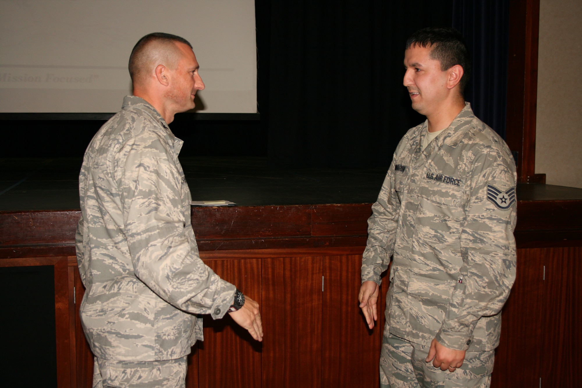 RAF CROUGHTON, United Kingdom - Staff. Sgt. Zafar Minarov is recognized by Col. Timothy Cashdollar, 501st Combat Support Wing commander, for being S.H.A.R.P.!