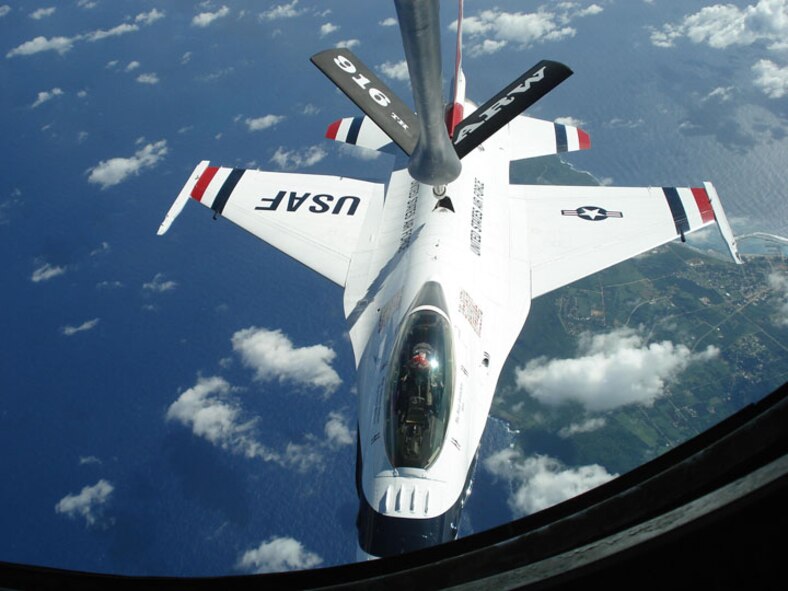 SEYMOUR JOHNSON AIR FORCE BASE, N.C. -- A KC-135 from Seymour Johnson refuels a U.S. Air Force Thunderbird on its way to the Andersen Air Force Base Air Show in Guam.                      