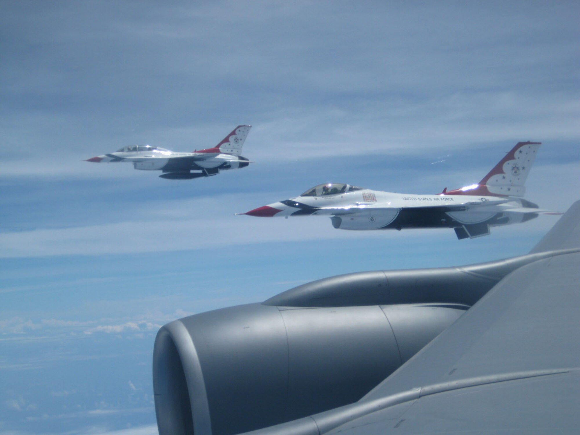 SEYMOUR JOHNSON AIR FORCE BASE, N.C. -- Two F-16 Fighting Falcons from the U.S. Air Force Thunderbirds off the tip of an Air Force Reserve KC-135R from the 916th Air Refueling Wing.