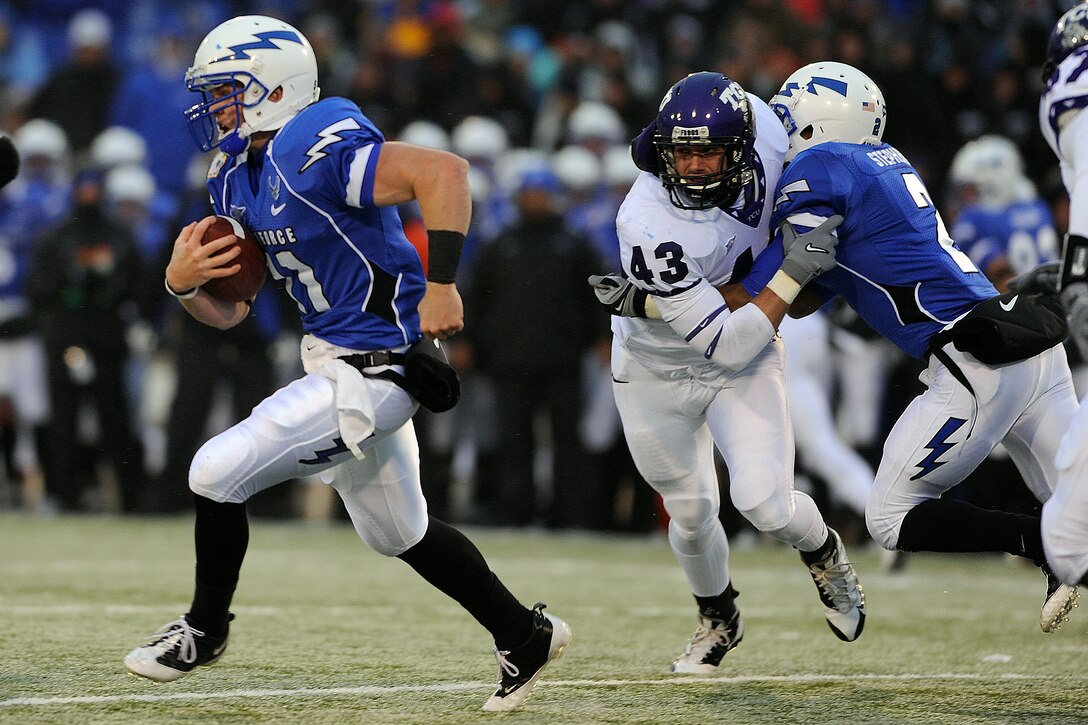 Falcons sophomore quarterback Connor Dietz runs downfield on a keeper against the Horned Frogs in the Air Force-TCU game at Falcon Stadium Oct. 10, 2009. Dietz, a native of Columbus, Ohio, had 71 rushing yards and a touchdown and was 6-of-17 passing for 42 yards. (U.S. Air Force photo/Mike Kaplan)