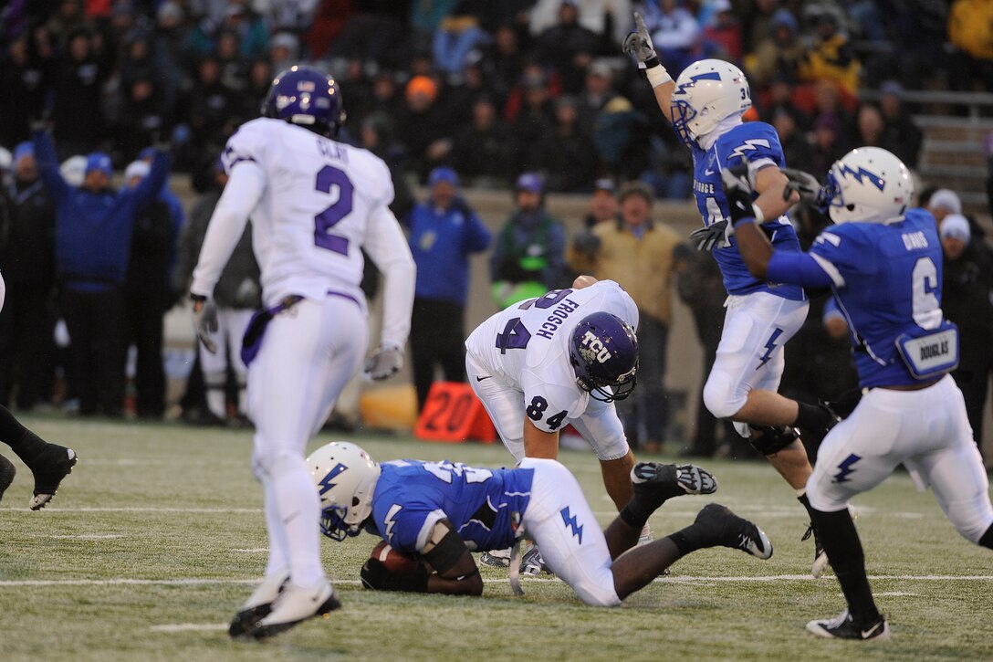 Falcons freshman defensive back Brian Lindsay makes a diving interception during the Air Force-TCU game at Falcon Stadium Oct. 10, 2009. Air Force also forced two fumbles during the game, giving the Falcons 20 takeaways on the season. Lindsay is a native of Chicago. (U.S. Air Force photo/Mike Kaplan)