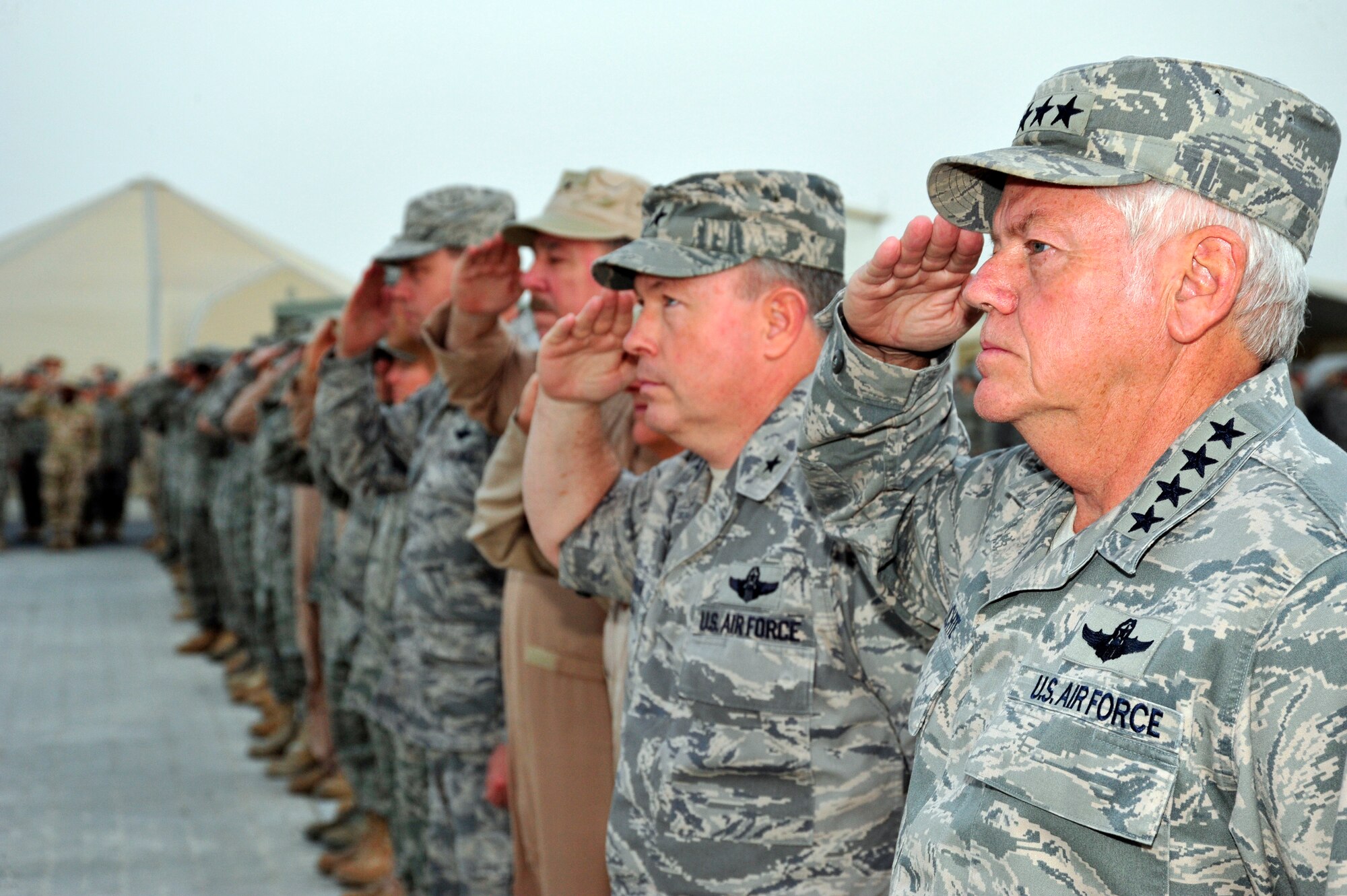 SOUTHWEST ASIA -Gen. Arthur Lichte, Air Mobility Command commander, salutes
the flag during a Retreat Ceremony here Oct. 9, 2009. General Lichte visited
the 380th Air Expeditionary Wing to provide the Airmen an opportunity to ask
questions or voice concerns regarding the mobility mission. (U.S. Air Force
photo/Tech. Sgt. Charles Larkin Sr)
