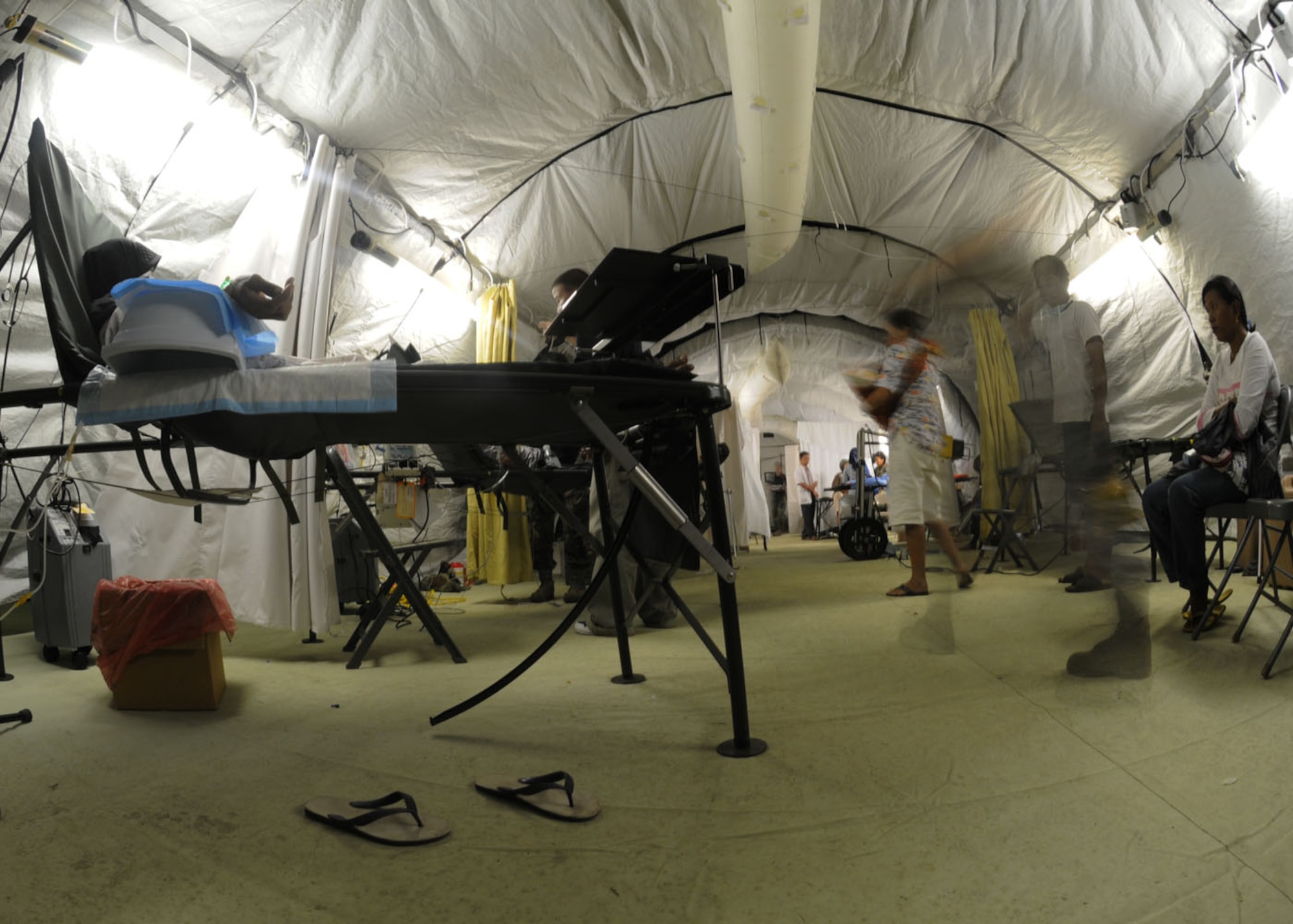 PADANG, Indonesia ? A U.S. Air Force humanitarian assistance rapid response team provides medical assistance to those affected by the recent earthquakes at a mobile field hospital here. HARRT Airmen are deployed from Andersen Air Force Base, Guam, Elmendorf AFB, Alaska, Hickam AFB, Hawaii and Yokota Air Base, Japan. (U.S. Air Force photo/Staff Sgt. Veronica Pierce)