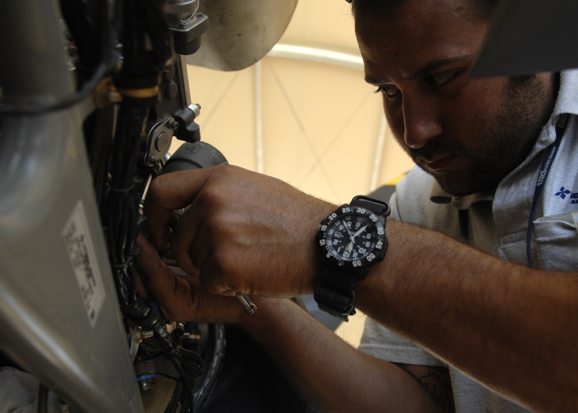 Guy Kemp replaces a prop pitch controller during engine maintenance on an MQ-9 Reaper here, Oct. 8, 2009. The MQ-9 Reaper has a 900 shaft horse power engine and is capable of travel up to speeds in excess of 230 miles per hour. Mr. Kemp is an aircraft mechanic from Creech Air Force Base, Nev., and hails from Las Vegas, Nev. (U.S. Air Force photo/Senior Airman Timothy Taylor)