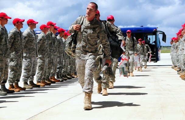 ANDERSEN AIR FORCE BASE - Guam - More than 50 Airmen from the 554th RED HORSE Squadron arrive home from a seven-month deployment Oct. 10 here. The Airmen were welcomed by members of their squadron, friends and family. This deployment was the unit's first deployment outside of the Pacific Air Forces' theater since the Vietnam War. (U.S. Air Force photo by Airman 1st Class Courtney Witt)