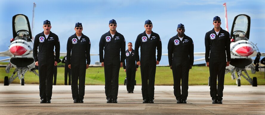 ANDERSEN AIR FORECE BASE, Guam - USAF Thunderbird pilots line up for introduction before their ariel demonstration during Team Andersen Air Show '09 "Air Power Over the Marianas" Oct. 7. The U.S. Air Force Thunderbirds is the premier aerial demonstration team representing Airmen worldwide. Andersen AFB rescheduled its air show for after canceling it due Typhoon Melor.  The air show is being held primarily to thank the residents of Guam for their continued support to Andersen AFB and the rest of the United States Air Force. (U.S. Air Force photo by Airman 1st Class Courtney Witt)