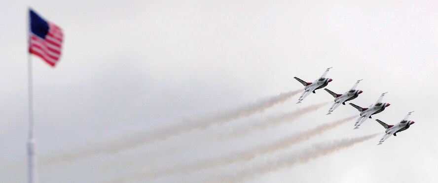 ANDERSEN AIR FORECE BASE, Guam - The Air Force Thunderbirds perform a maneuver for the audience attending the Team Andersen Air Show '09 "Air Power over the Marianas" here on Andersen Air Force Base, Guam, Oct. 7. The U.S. Air Force's aerial demonstration team, the Thunderbirds, were one of four aerial demonstration teams to perform for the audience. (U.S. Air Force photo by Airman 1st Class Courtney Witt)