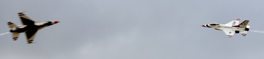 ANDERSEN AIR FORECE BASE, Guam - The Air Force Thunderbirds perform a maneuver for the audience attending the Team Andersen Air Show '09 "Air Power over the Marianas" here on Andersen Air Force Base, Guam, Oct. 7. The U.S. Air Force's aerial demonstration team, the Thunderbirds, were one of four aerial demonstration teams to perform for the audience. (U.S. Air Force photo by Airman 1st Class Courtney Witt)