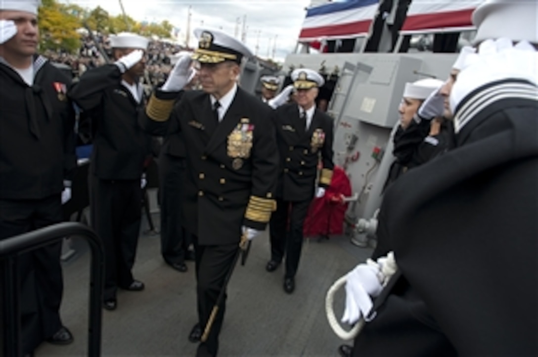 U.S. Navy Adm. Mike Mullen, chairman of the Joint Chiefs of Staff, and Adm. Gary Roughead, chief of naval operations, depart U.S. Navy's newest Arleigh Burke-class guided missile destroyer, USS Wayne E. Meyer. The admirals attended the ship's commissioning ceremony at Penn's Landing in Philadelphia, Oct. 10, 2009.