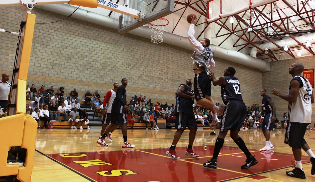 Blake Griffin, power forward, Los Angeles Clippers, dunks a basketball during a scrimmage game at Paige Field House, Camp Pendleton, Oct. 10. The team offered a free game to service members and their families for an up-close look at the team in action.