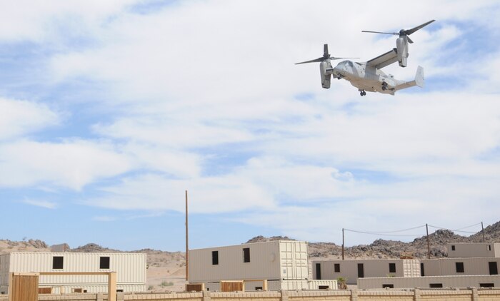 An MV-22 Osprey approaches an urban training range in Twentynine Palms, Calif., on Oct. 10, 2009, in order to pick up the Marines it dropped off less than an hour earlier. For the New River, N.C.-based Osprey pilots and crew, the helo raid was part of their training for the Weapons and Tactics Instructors course taught by Marine Aviation Weapons and Tactics Squadron 1 based at the Marine Corps Air Station in Yuma, Ariz.