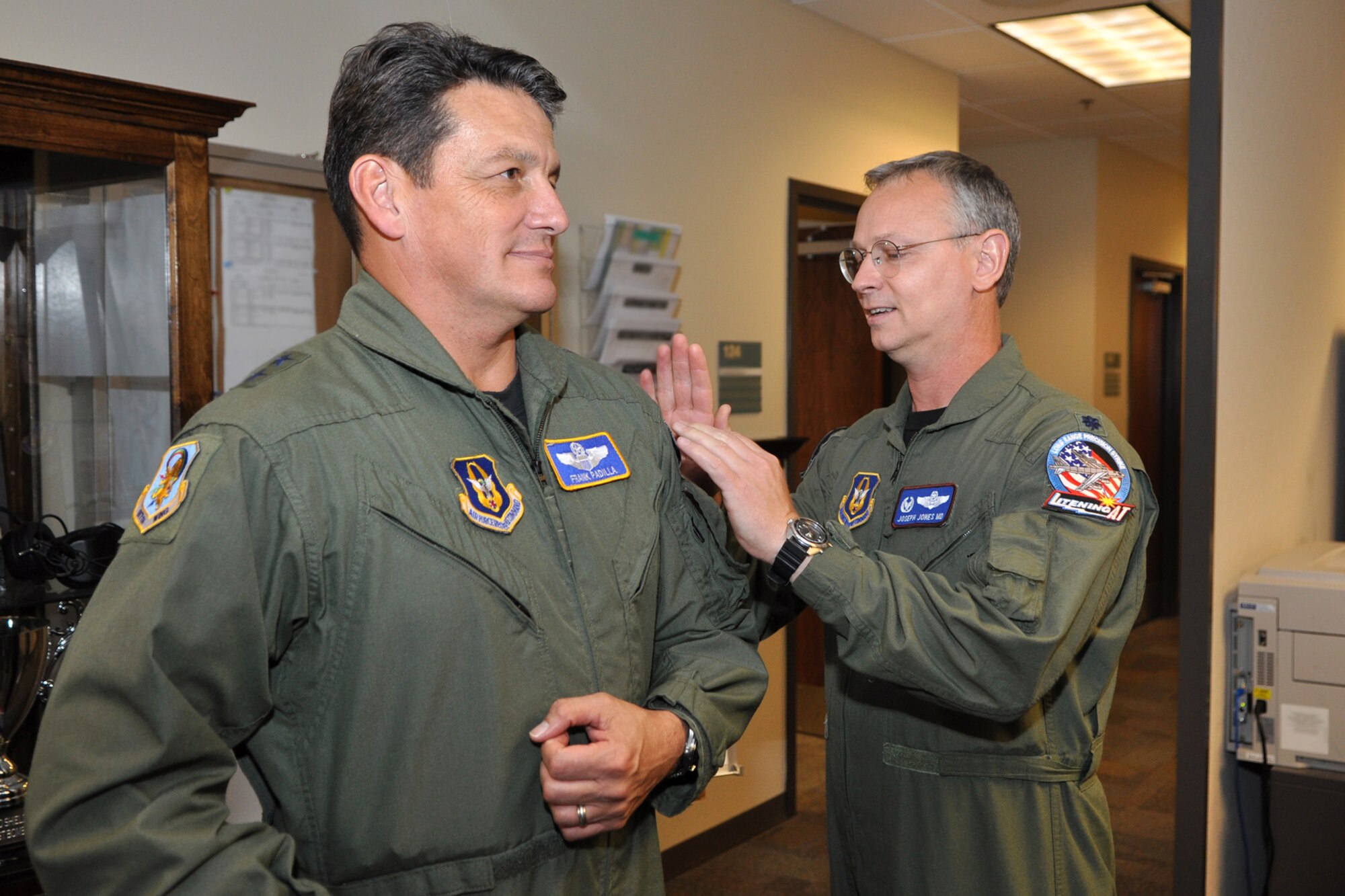 Lt. Col. Joseph Jones, 93rd Bomb Squadron, commander, slaps a historical 93rd BS patch onto the shoulder of Maj. General Frank Padilla, 10th Air Force, commander, during the general’s visit to the 93rd BS headquarters building of the 917th Wing at Barksdale Air Force Base, La., October 7, 2009. The patch design dates back to when the 93rd BS was the 93rd Aero Squadron deployed to Vaucouleurs, France, during World War I. Recently appointed, the 10th Air Force Commander is taking the opportunity to visit the 917th Wing and other commands under the 10 AF umbrella. (U.S. Air Force photo/Tech. Sgt. Jeff Walston) 