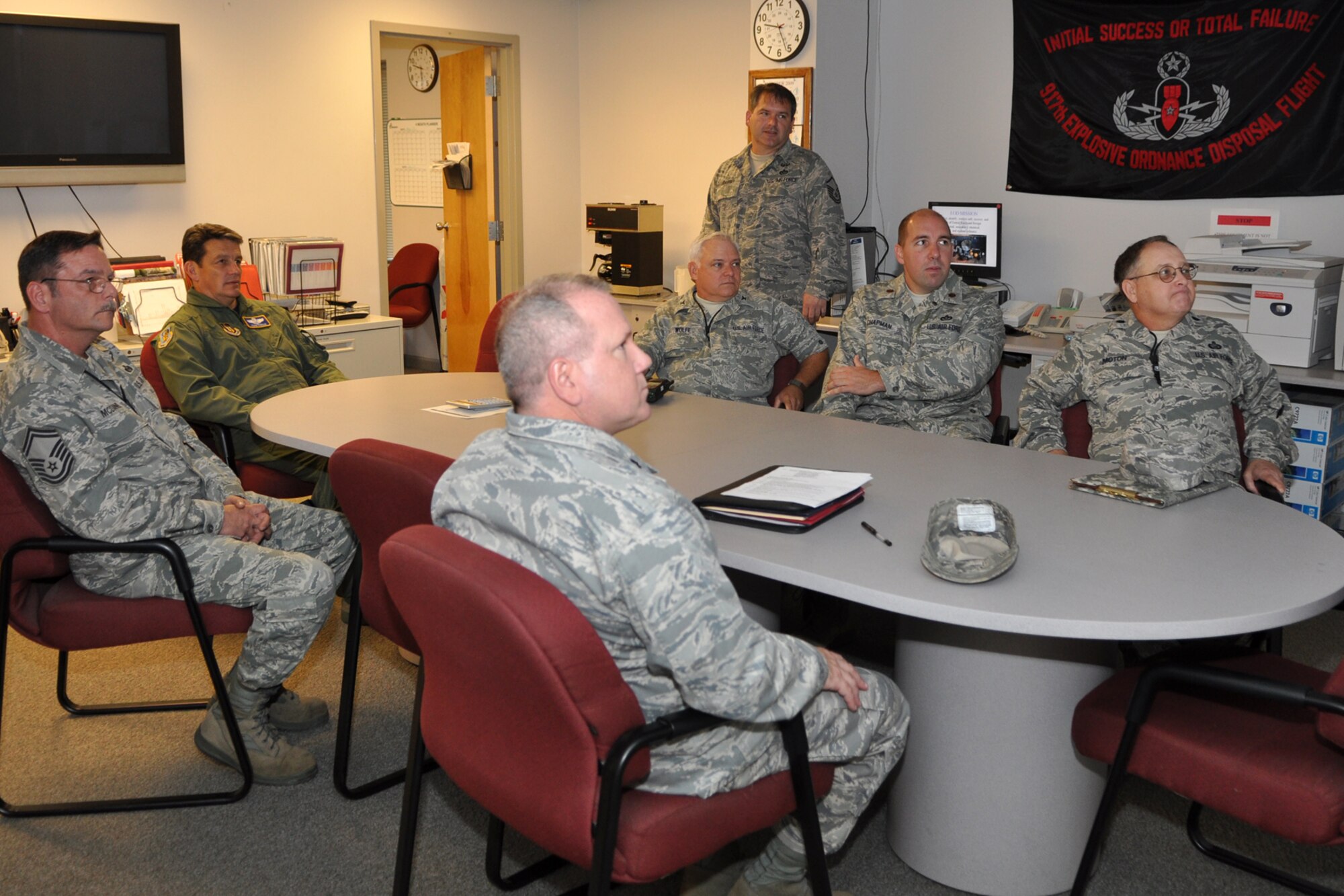 Master Sgt. Dannie Davis, 917th Explosive Ordnance Disposal, program manager, (standing) gives a flight briefing on the capabilities of the 917th EOD unit, to senior personnel during a visit by Maj. General Frank Padilla, 10th Air Force, commander, to the EOD compound on Barksdale Air Force Base, La., October 7, 2009. Recently appointed, the 10th Air Force Commander is taking the opportunity to visit the 917th Wing and other commands under the 10 AF umbrella to get to know the Airmen and have a better understanding of the individual missions of the units under his command. (U.S. Air Force photo/Tech. Sgt. Jeff Walston)