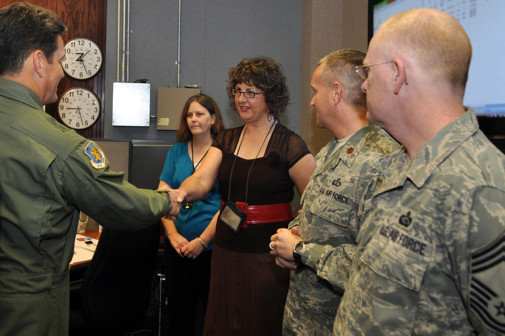 Maj. General Frank Padilla, 10th Air Force, commander, meets Donna McMillian,  917th Wing, chief of personnel readiness, in the Tour Reserve Deployment Readiness Cell (RDRC) Office during a tour of the 917th Wing headquarters at Barksdale Air Force Base, La., October 7, 2009. Recently appointed, the 10th Air Force Commander is taking the opportunity to visit the 917th Wing and other commands under the 10 AF umbrella to get to know the Airmen and have a better understanding of the individual missions of the units under his command. (U.S. Air Force photo/Tech. Sgt. Jeff Walston)