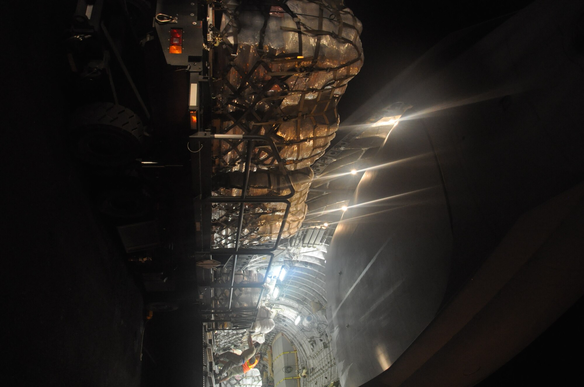 Airmen from McChord Air Force Base, Wash., and Hickam AFB, Hawaii, and Air Mobility Command civilians offload Federal Emergency Management Agency cargo from a McChord C-17 Globemaster III Oct. 10 at Pago Pago International Airport, American Samoa. (U.S. Air Force photo/Staff Sgt. Eric Burks)