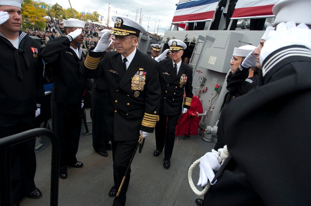 U.S. Navy Adm. Mike Mullen, chairman of the Joint Chiefs of Staff, and Adm. Gary Roughead, chief of naval operations, leave USS Wayne E. Meyer at conclusion of the ship's commissioning ceremony at Penn's Landing in Philadelphia, Oct. 10, 2009.