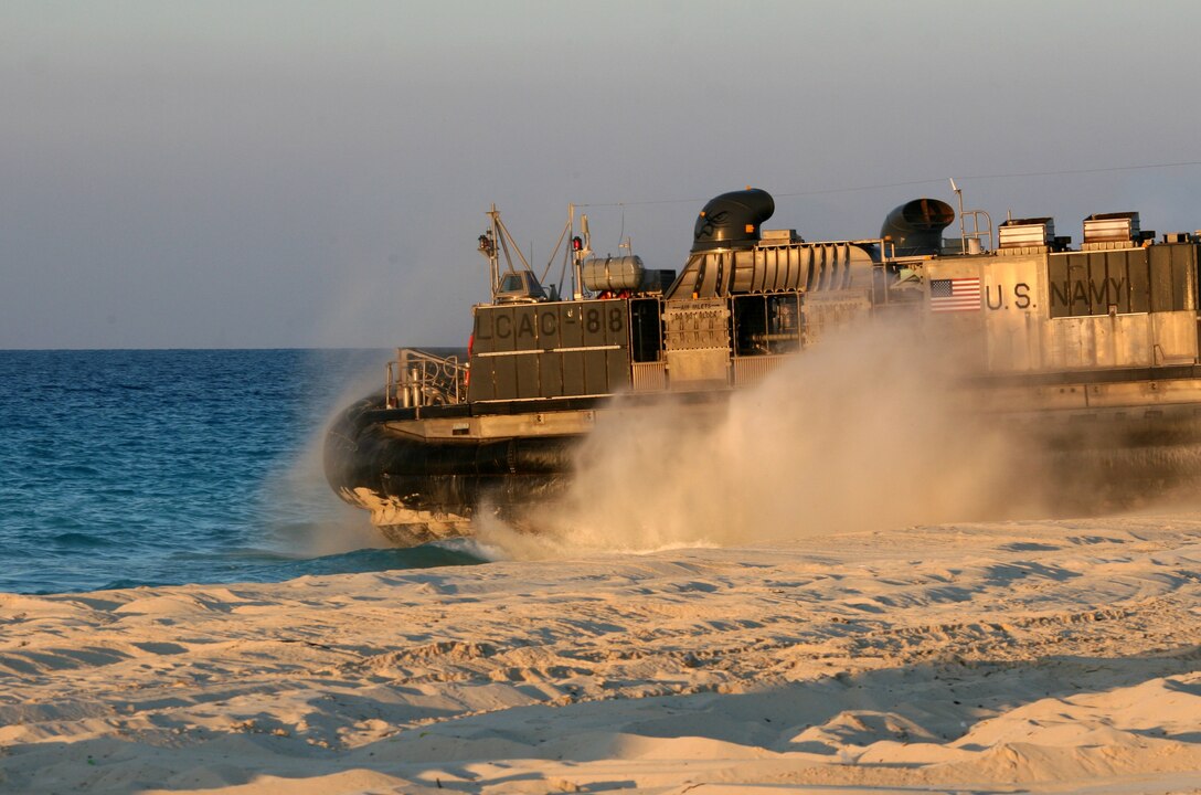A Landing Craft, Air-Cushioned, from Assault Craft Unit 4 heads back to sea after dropping off cargo during an offload for Exercise Bright Star 2009 in Egypt Oct. 11, 2009. The multinational exercise is designed to improve readiness, interoperability, and strengthen the military and professional relationships among U.S., Egyptian and participating forces. Bright Star is conducted by U.S. Central Command and held every two years. Elements of the 22nd MEU are currently are participating in the multi-national exercise while serving as the theater reserve force for U.S. Central Command.::r::::n::(Official Marine Corps photo by Cpl. Theodore W. Ritchie)::r::::n::