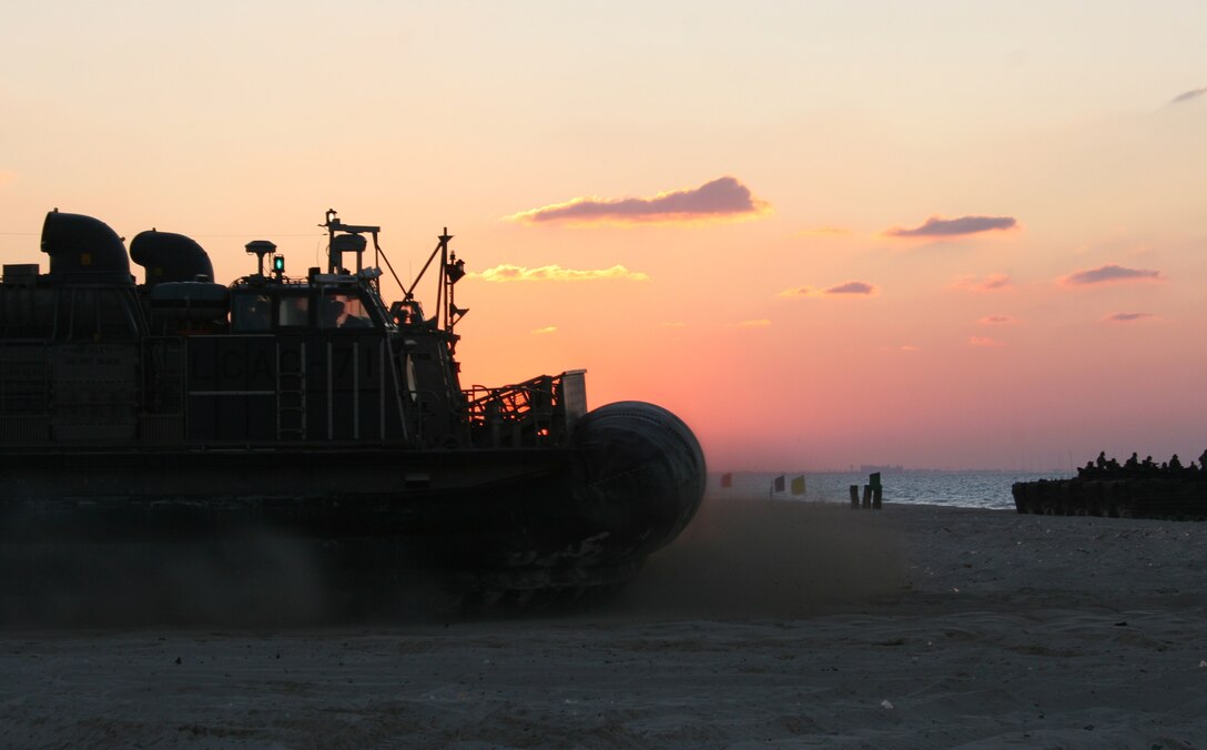 A Landing Craft, Air-Cushioned from Assault Craft Unit 4 heads out to sea after dropping off cargo during an offload for Exercise Bright Star 2009 in Egypt Oct. 11, 2009. The multinational exercise is designed to improve readiness, interoperability, and strengthen the military and professional relationships among U.S., Egyptian and participating forces. Bright Star is conducted by U.S. Central Command and held every two years. Elements of the 22nd MEU are currently are participating in the multi-national exercise while serving as the theater reserve force for U.S. Central Command.::r::::n::(Official Marine Corps photo by Cpl. Theodore W. Ritchie)::r::::n::