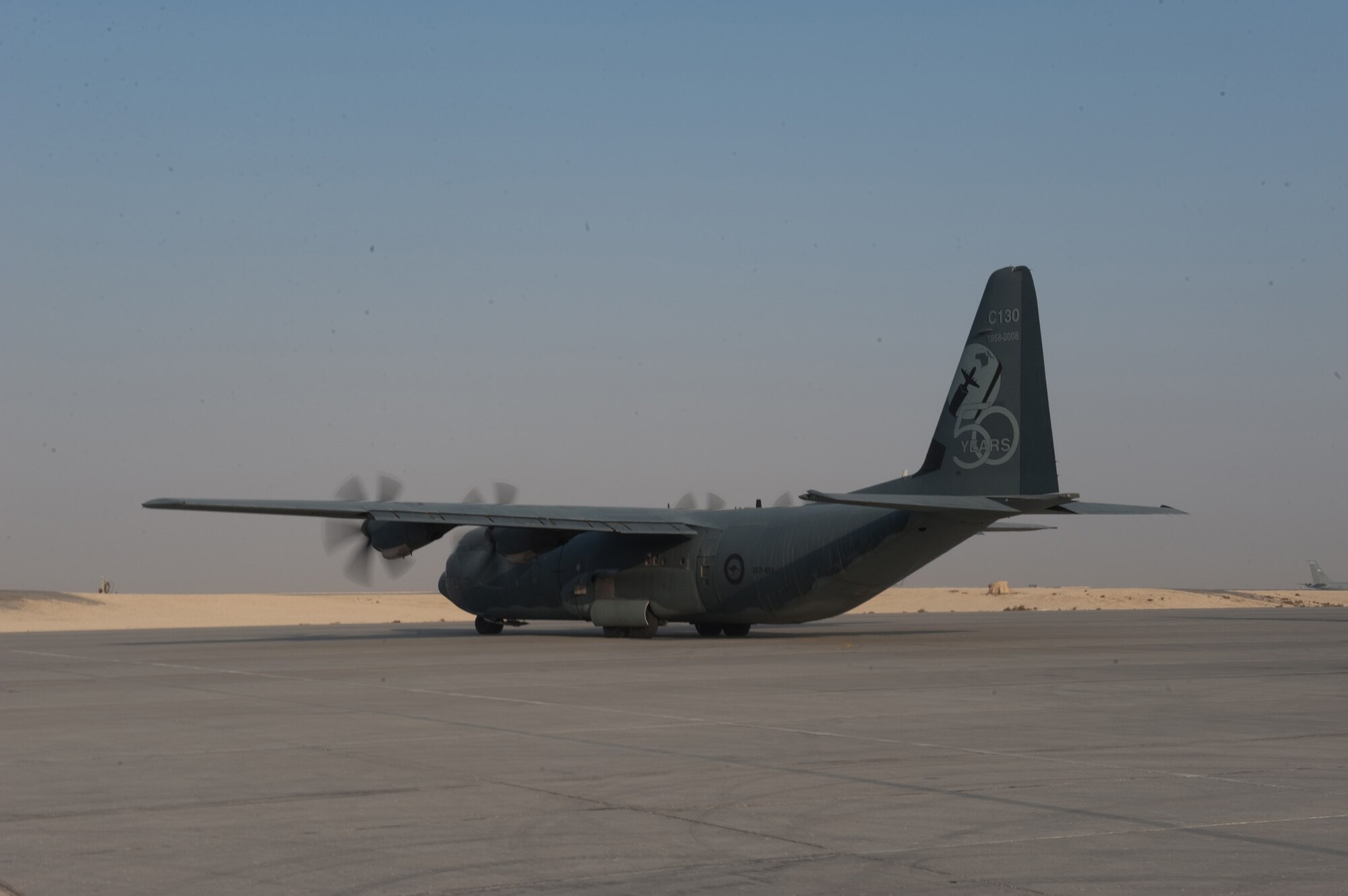 A Royal Australian Air Force C-130J from No. 37 Squadron prepares to take off on an airlift mission, Oct. 11, in Southwest Asia. The No. 37 Squadron C-130Js provide intra-theater combat airlift support throughout Southwest Asia in support of Operation Slipper, Australian's military contribution to international campaigns against terrorism.. (U.S. Air Force photo/Staff Sgt. Robert Barney) 