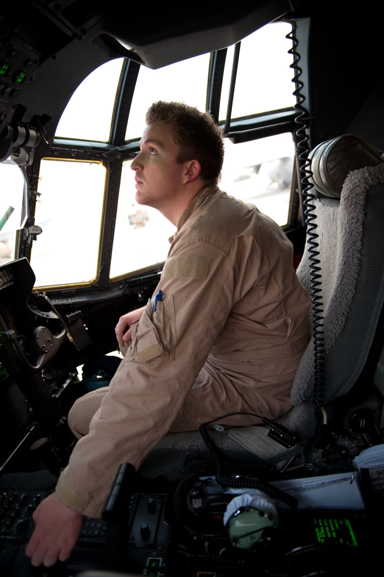 Royal Australian Air Force Flying Officer Ben Hansel, No. 37 Squadron pilot, goes through C-130J preflight procedures in preparation for departure, Oct. 11, in Southwest Asia. No. 37 Squadron C-130Js provide intra-theater combat airlift support throughout Southwest Asia in support of Australian and allied forces. Flying Officer Hansel is deployed from RAAF Base Richmond, Australia, in support of Operation Slipper, Australian's military contribution to international campaigns against terrorism. (U.S. Air Force photo/Staff Sgt. Robert Barney) 
