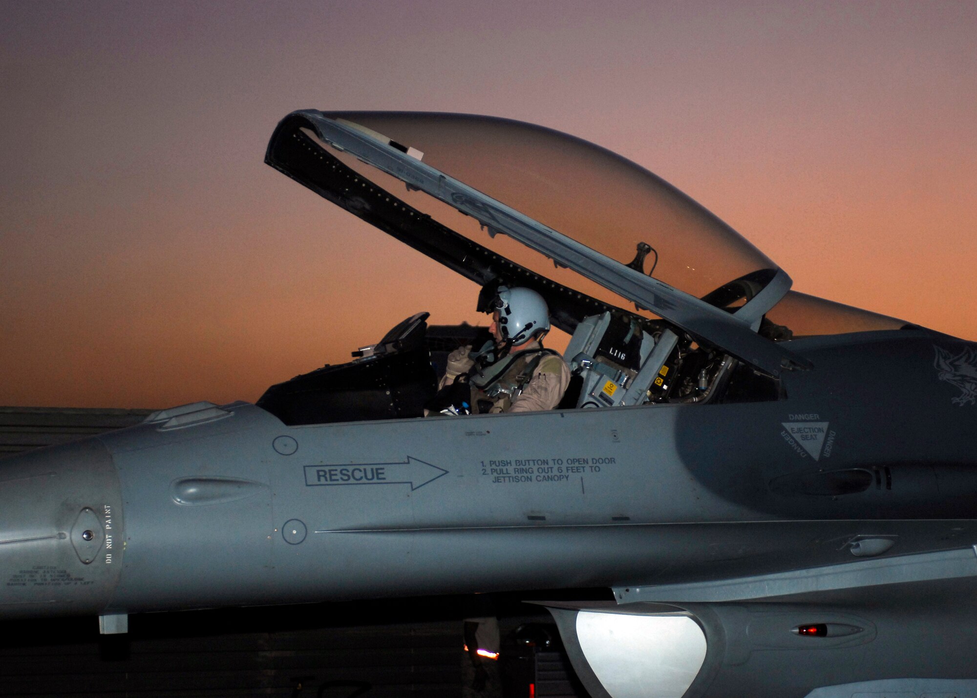 BAGRAM AIRFIELD, Afghanistan -- Captain Brandon Roth, an F-16 Fighting Falcon pilot from the 79th Expeditionary Fighter Squadron, opens the canopy to get out of the aircraft here, Oct. 11, 2009.  Known as the "Tigers," the F-16s are deployed from the 79th Fighter Squadron out of Shaw Air Force Base, S.C.  The Tigers mission while here is to provide tactical air-to-air and air-to-ground support while supporting Operation Enduring Freedom.  Captain Roth is deployed from Shaw Air Force Base, S.C., and hails from Baltimore, Md.  (U.S. Air Force photo/Senior Airman Felicia Juenke)