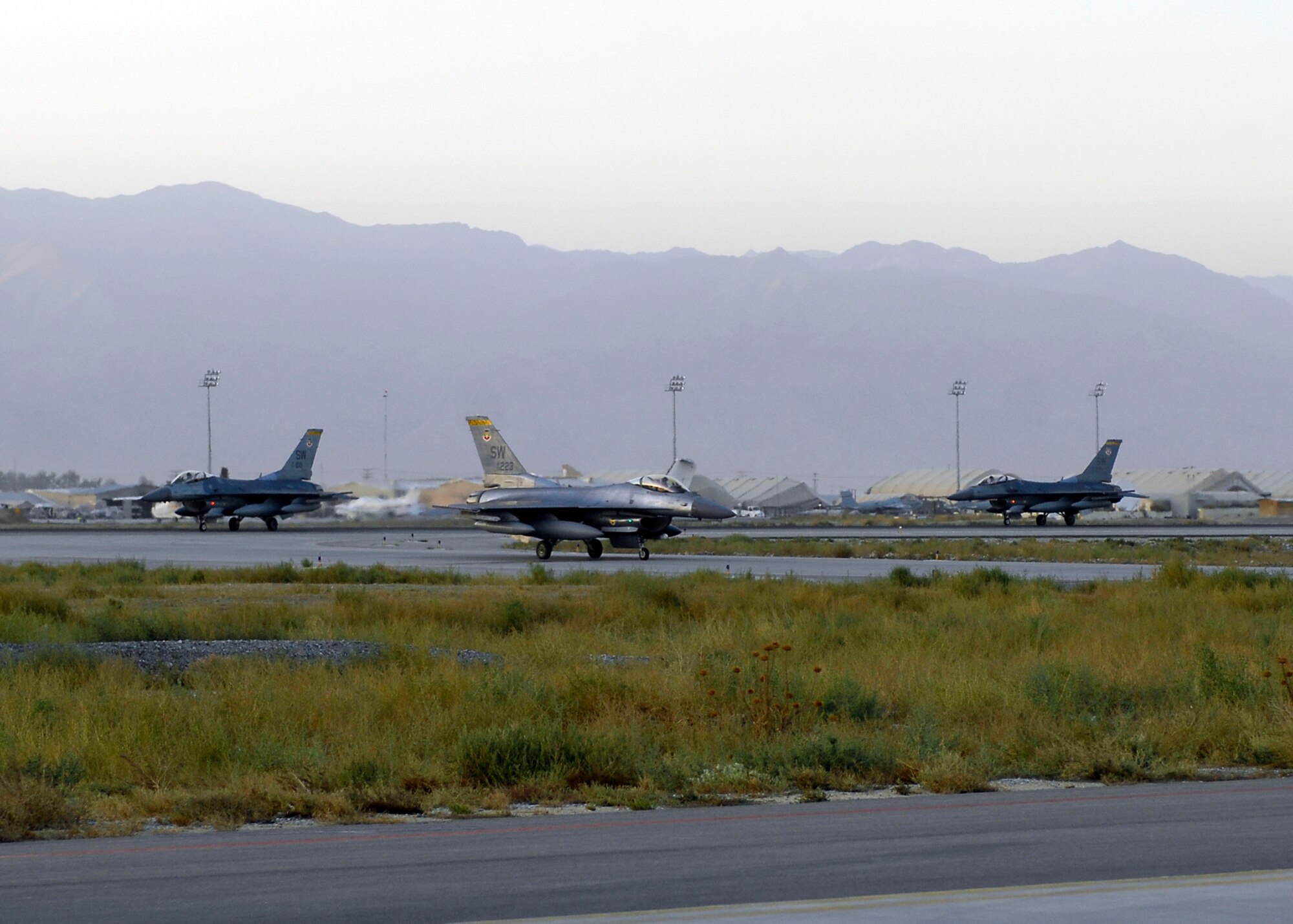 BAGRAM AIRFIELD, Afghanistan -- F-16 Fighting Falcons, from the 79th Expeditionary Fighter Squadron, taxi in after landing here, Oct. 11, 2009.  Known as the "Tigers," these F-16s are deployed from the 79th Fighter Squadron out of Shaw Air Force Base, S.C.  The Tigers mission while here is to provide tactical air-to-air and air-to-ground support while supporting Operation Enduring Freedom.  (U.S. Air Force photo/Senior Airman Felicia Juenke)