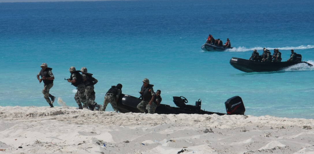 Egyptian special forces assault the beach during an amphibious assault demonstration conducted as part of Bright Star 2009 in Egypt Oct. 12, 2009. The multinational exercise is designed to improve readiness, interoperability, strengthen the military and professional relationships among U.S., Egyptian and participating forces. Bright Star is conducted by U.S. Central Command and held every two years. ::r::::n::(Official Marine Corps photo by Staff Sgt. Matt Epright)::r::::n::