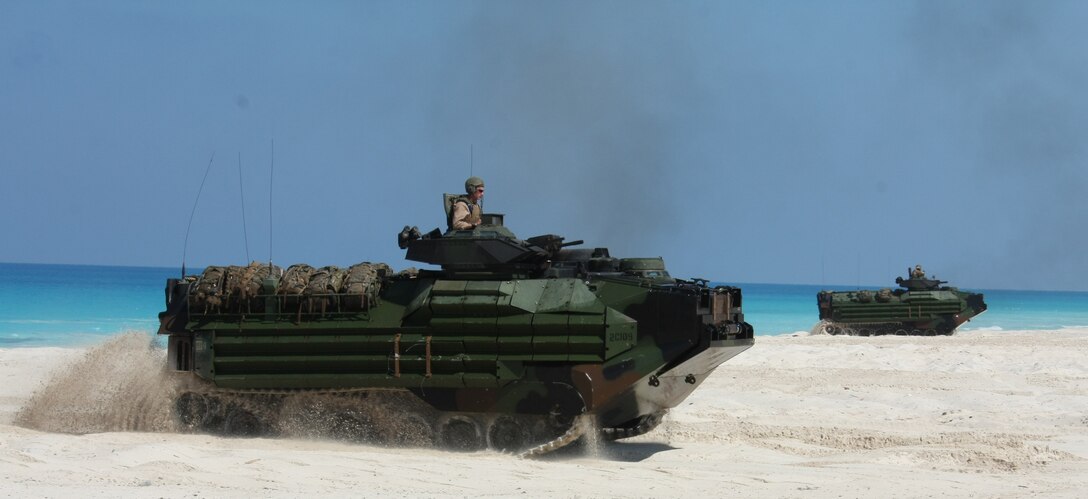 Amphibious Assault Vehicles from India Company, Battalion Landing Team, 3rd Battalion, 2nd Marine Regiment, 22nd Marine Expeditionary Unit (MEU), assault the beach during an amphibious assault demonstration conducted as part of Bright Star 2009 in Egypt Oct. 12, 2009. The multinational exercise is designed to improve readiness, interoperability, strengthen the military and professional relationships among U.S., Egyptian and participating forces. Bright Star is conducted by U.S. Central Command and held every two years. Elements of the 22nd MEU are currently are participating in the multi-national exercise while serving as the theater reserve force for U.S. Central Command. ::r::::n::(Official Marine Corps photo by Staff Sgt. Matt Epright)::r::::n::