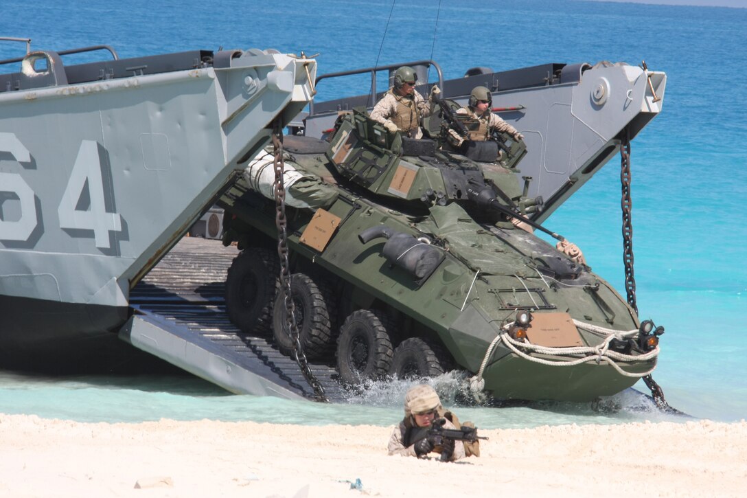 A light-armored vehicle from Weapons Company, Battalion Landing Team, 3rd Battalion, 2nd Marine Regiment, 22nd Marine Expeditionary Unit (MEU), assaults the beach from a landing craft utility from Assault Craft Unit (ACU) 2 during an amphibious assault demonstration conducted as part of Bright Star 2009 in Egypt Oct. 12, 2009. The multinational exercise is designed to improve readiness, interoperability, strengthen the military and professional relationships among U.S., Egyptian and participating forces. Bright Star is conducted by U.S. Central Command and held every two years. Elements of the 22nd MEU are currently are participating in the multi-national exercise while serving as the theater reserve force for U.S. Central Command. ::r::::n::(Official Marine Corps photo by Staff Sgt. Matt Epright)::r::::n::