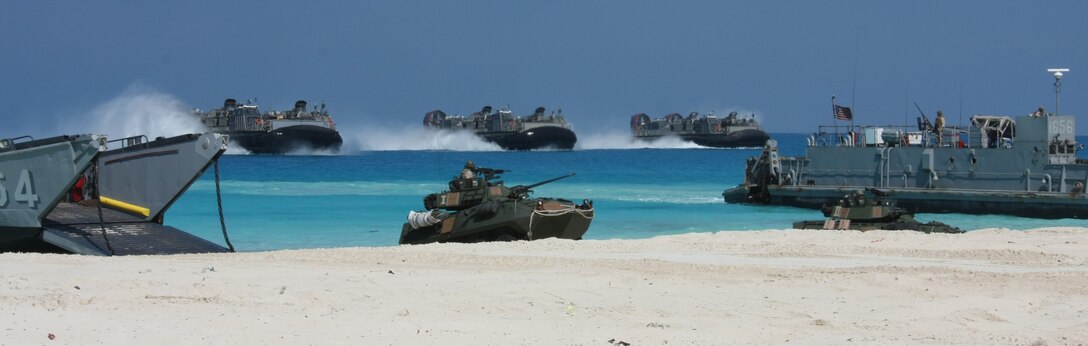 Three landing craft air-cushioned (LCAC) from Assault Craft Unit (ACU) 4 approach the beach during an amphibious assault demonstration conducted as part of Bright Star 2009 in Egypt Oct. 12, 2009. The multinational exercise is designed to improve readiness, interoperability, strengthen the military and professional relationships among U.S., Egyptian and participating forces. Bright Star is conducted by U.S. Central Command and held every two years. ::r::::n::(Official Marine Corps photo by Staff Sgt. Matt Epright)::r::::n::