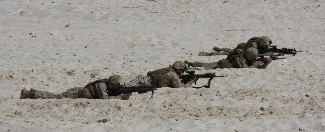 Marines from India Company, 3rd Battalion, 2nd Marine Regiment, 22nd Marine Expeditionary Unit (MEU), provide security during an amphibious assault demonstration conducted as part of Bright Star 2009 in Egypt Oct. 12, 2009. The multinational exercise is designed to improve readiness, interoperability, strengthen the military and professional relationships among U.S., Egyptian and participating forces. Bright Star is conducted by U.S. Central Command and held every two years. Elements of the 22nd MEU are currently are participating in the multi-national exercise while serving as the theater reserve force for U.S. Central Command. ::r::::n::(Official Marine Corps photo by Staff Sgt. Matt Epright)::r::::n::