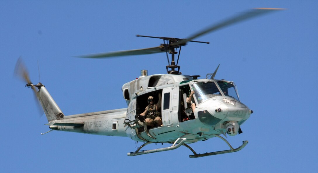 Cpl. Justin G. Noel, a UH-1N Huey helicopter crew chief with Marine Medium Tiltrotor Squadron (VMM) 263 (Reinforced), 22nd Marine Expeditionary Unit (MEU), and native of Scottsdale, Ariz., scans the area while Capt. Adam Snyder and Capt. Leigh Irwin fly the aircraft during an amphibious assault demonstration conducted as part of Bright Star 2009 in Egypt Oct. 12, 2009. The multinational exercise is designed to improve readiness, interoperability, strengthen the military and professional relationships among U.S., Egyptian and participating forces. Bright Star is conducted by U.S. Central Command and held every two years. Elements of the 22nd MEU are currently are participating in the multi-national exercise while serving as the theater reserve force for U.S. Central Command. ::r::::n::(Official Marine Corps photo by Staff Sgt. Matt Epright)::r::::n::