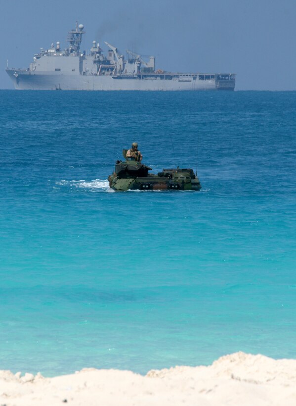 An amphibious assault vehicle from Battalion Landing Team, 3rd Battalion, 2nd Marine Regiment, 22nd Marine Expeditionary Unit (MEU), launched from amphibious dock landing ship USS Fort McHenry (LSD 43), prepares to storm the beach during an amphibious assault demonstration conducted as part of Bright Star 2009 in Egypt Oct. 12, 2009. The multinational exercise is designed to improve readiness, interoperability, strengthen the military and professional relationships among U.S., Egyptian and participating forces. Bright Star is conducted by U.S. Central Command and held every two years. Elements of the 22nd MEU are currently are participating in the multi-national exercise while serving as the theater reserve force for U.S. Central Command.::r::::n::(Official Marine Corps Photo by Cpl. Theodore W. Ritchie)