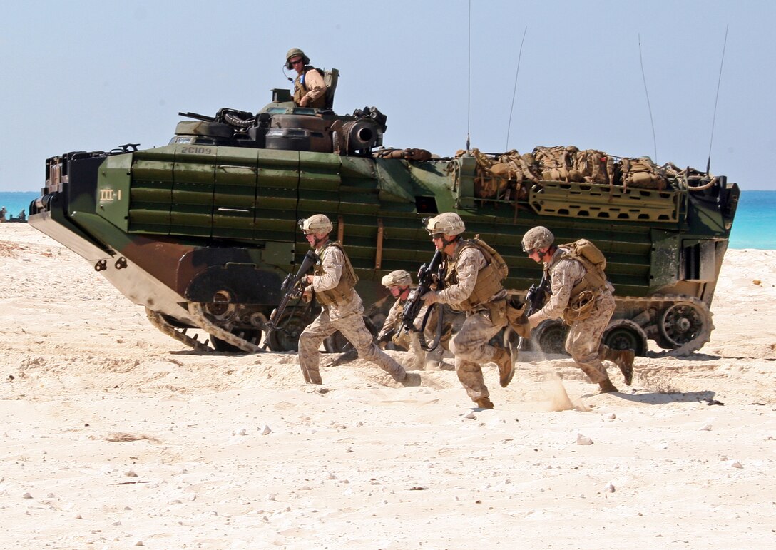 Marines from India Company, Battalion Landing Team, 3rd Battalion, 2nd Marine Regiment, 22nd Marine Expeditionary Unit (MEU), assault the beach during an amphibious assault demonstration conducted as part of Bright Star 2009 in Egypt Oct. 12, 2009. The multinational exercise is designed to improve readiness, interoperability, strengthen the military and professional relationships among U.S., Egyptian and participating forces. Bright Star is conducted by U.S. Central Command and held every two years. Elements of the 22nd MEU are currently are participating in the multi-national exercise while serving as the theater reserve force for U.S. Central Command.::r::::n::(Official Marine Corps Photo by Cpl. Theodore W. Ritchie)