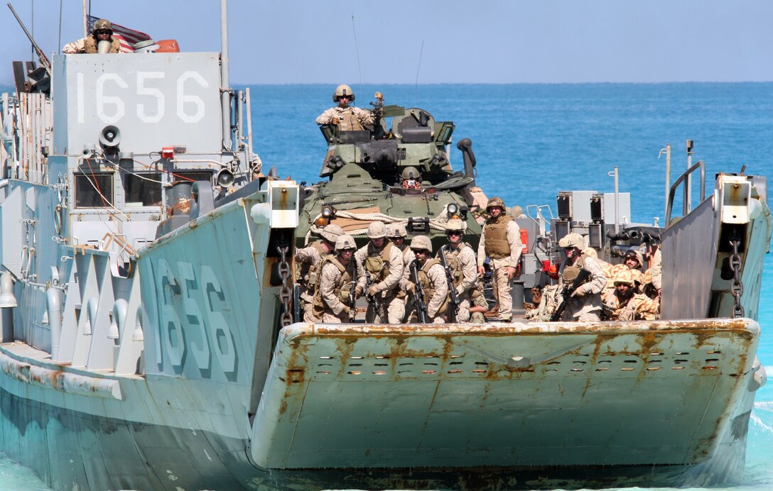 Marines from the 22nd Marine Expeditionary Unit (MEU) prepare to storm the beach from a landing craft utility (LCU) from Assault Craft Unit (ACU) 2 during an amphibious assault demonstration conducted as part of Bright Star 2009 in Egypt Oct. 12, 2009. The multinational exercise is designed to improve readiness, interoperability, strengthen the military and professional relationships among U.S., Egyptian and participating forces. Bright Star is conducted by U.S. Central Command and held every two years. Elements of the 22nd MEU are currently are participating in the multi-national exercise while serving as the theater reserve force for U.S. Central Command.::r::::n::(Official Marine Corps Photo by Cpl. Theodore W. Ritchie)::r::::n::