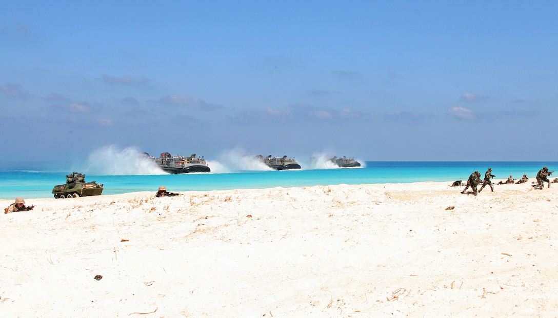Three landing craft, air-cushioned (LCAC) with Assault Craft Unit (ACU) 4 approach the beach during an amphibious assault demonstration conducted as part of Bright Star 2009 in Egypt Oct. 12, 2009. The multinational exercise is designed to improve readiness, interoperability, strengthen the military and professional relationships among U.S., Egyptian and participating forces. Bright Star is conducted by U.S. Central Command and held every two years. ::r::::n::(Official Marine Corps Photo by Cpl. Theodore W. Ritchie)::r::::n::
