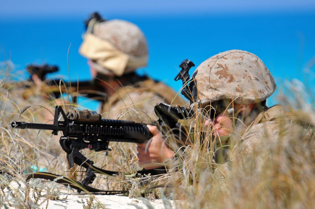 Marines from the 22nd Marine Expeditionary Unit (MEU) tactically position themselves during an amphibious assault demonstration near Alexandria, Egypt, in support of exercise Bright Star 2009. The multinational exercise is designed to improve readiness, interoperability, and strengthen military and professional relationships among U.S., Egyptian and several other participating forces. Bright Star is conducted by U.S. Central Command and held every two years. (U.S. Navy photo by Mass Communication Specialist 2nd Class (SW) Stephen Oleksiak/RELEASED)