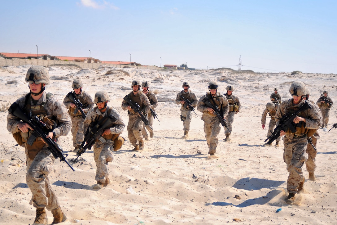 Marines from the 22nd Marine Expeditionary Unit (MEU) advance on the beach during an amphibious assault demonstration near Alexandria, Egypt, in support of exercise Bright Star 2009. The multinational exercise is designed to improve readiness, interoperability, and strengthen military and professional relationships among U.S., Egyptian and several other participating forces. Bright Star is conducted by U.S. Central Command and held every two years (U.S. Navy photo by Mass Communication Specialist 2nd Class (SW) Stephen Oleksiak/RELEASED)