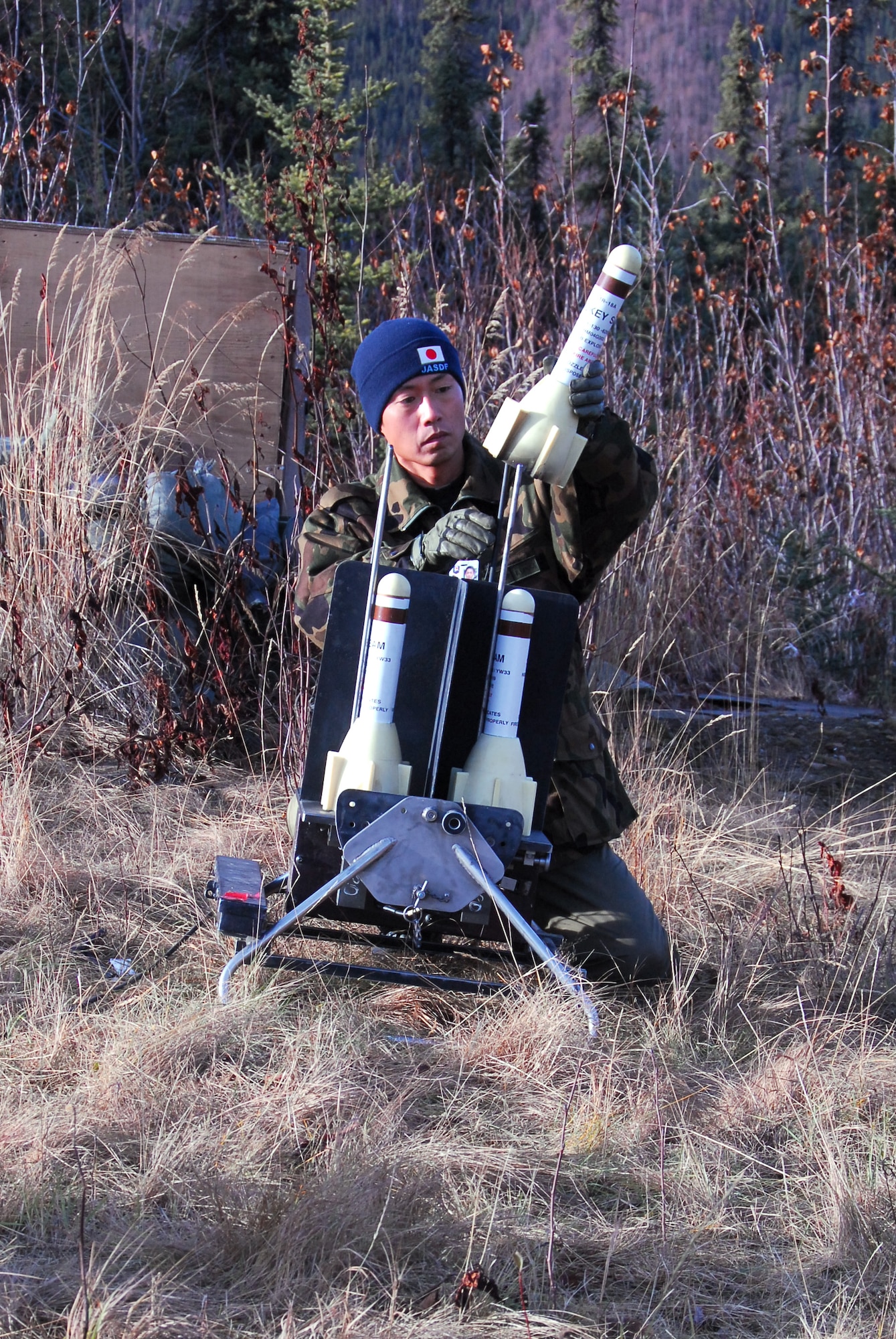 Staff Sgt. Kazuma Yamaji prepares Smokey Sams to simulate launching an anti-aircraft rocket for training during RED FLAG-Alaska 10-1 Oct. 9, 2009, Eielson Air Force Base, Alaska. RF-A is a Pacific Air Forces-directed field training exercise for U.S. and coalition forces under simulated combat conditions. Sergeant Yamaji is a Japan Air Self Defense Force airmen assigned to Naha Air Base, Okinawa, Japan. (U.S. Air Force photo/Tech. Sgt. Shad Eidson)

