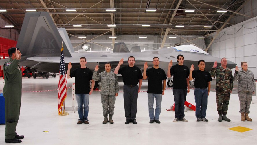 Lt. Col. John Hillyer, Commander, 477th Fighter Group administers the Oath of Enlistment to new enlistees for the Air Force Reserve in front of the Air Force?s premier fighter jet, the F-22 Raptor.  The enlistees are from across the state of Alaska and will go to basic military training over the next year before becoming Traditional Reservists.  Traditional Reservists are Citizen Airmen who serve one weekend a month, two weeks a year.  Currently there are approximately 240 people assigned to the 477th FG.  Recruiting efforts are on-going to achieve the group?s goal to have 425 Citizen Airmen by 2012.  Enlistees sworn in today will be trained to perform a variety of functions including paralegal, supply, chaplain?s assistance, F-22 maintenance, and fuels. (Air Force Photo/Maj. Cary McPartlin)