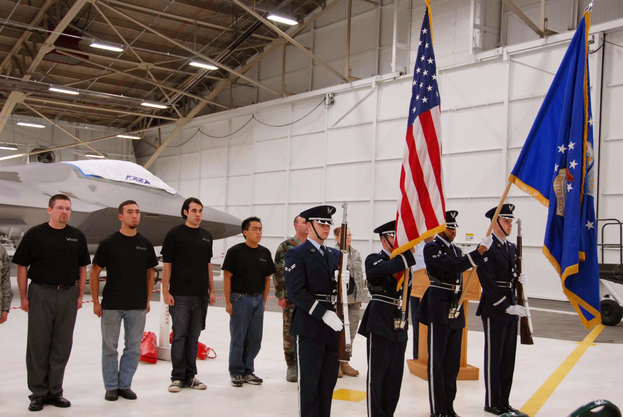 The Elmendorf Air Force Base Honor Guard presents the colors at the Air Force Reserve enlistment ceremony held in front of the Air Force's premier fighter jet, the F-22 Raptor.  The enlistees are from across the state of Alaska and will go to basic military training over the next year.  The ceremony was the culmination of a very successful recruiting year for the 477th Fighter Group, the Air Force Reserve Command's first F-22 Raptor unit and the first Reserve flying unit based in the Pacific theater of operations.  The Group is a Classic Associate unit responsible for recruiting, training, developing and retaining Citizen Airmen to support Expeditionary Air Force mission requirements. (Air Force Photo/Maj. Cary McPartlin)