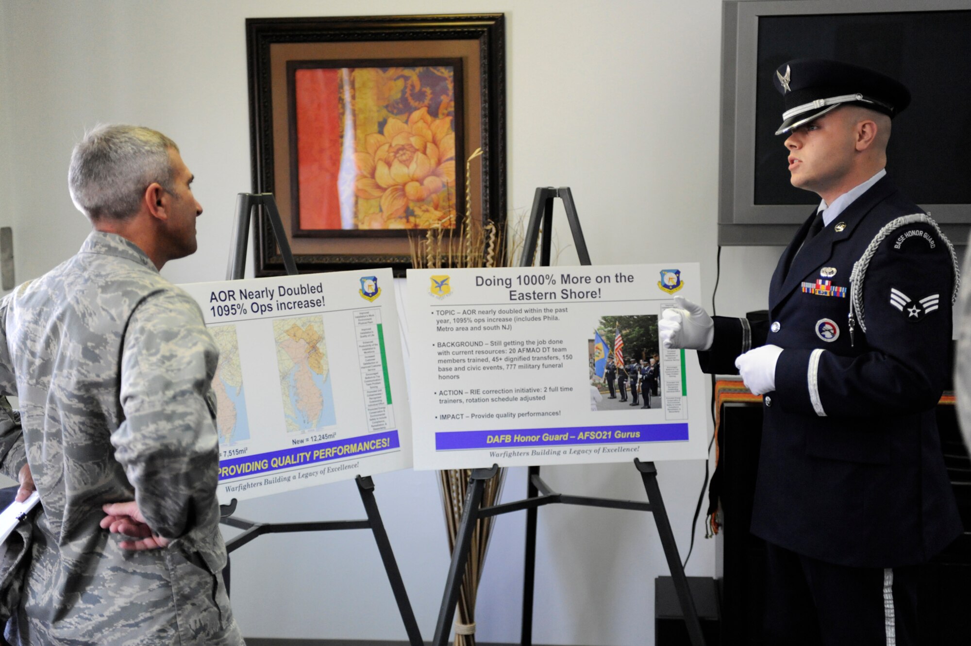 Senior Airman Robert Landon, 436th Force Support Squadron, briefs Col. Frank Jones, Air Mobility Command Installation Excellence Selection Board team member, about the enlarged area of responsibility for the Dover Air Force Base Honor Guard Oct. 7. Team Dover was named the AMC winner Oct. 13, and will now compete at the Air Force level. (U.S. Air Force photo by John Sidoriak)
