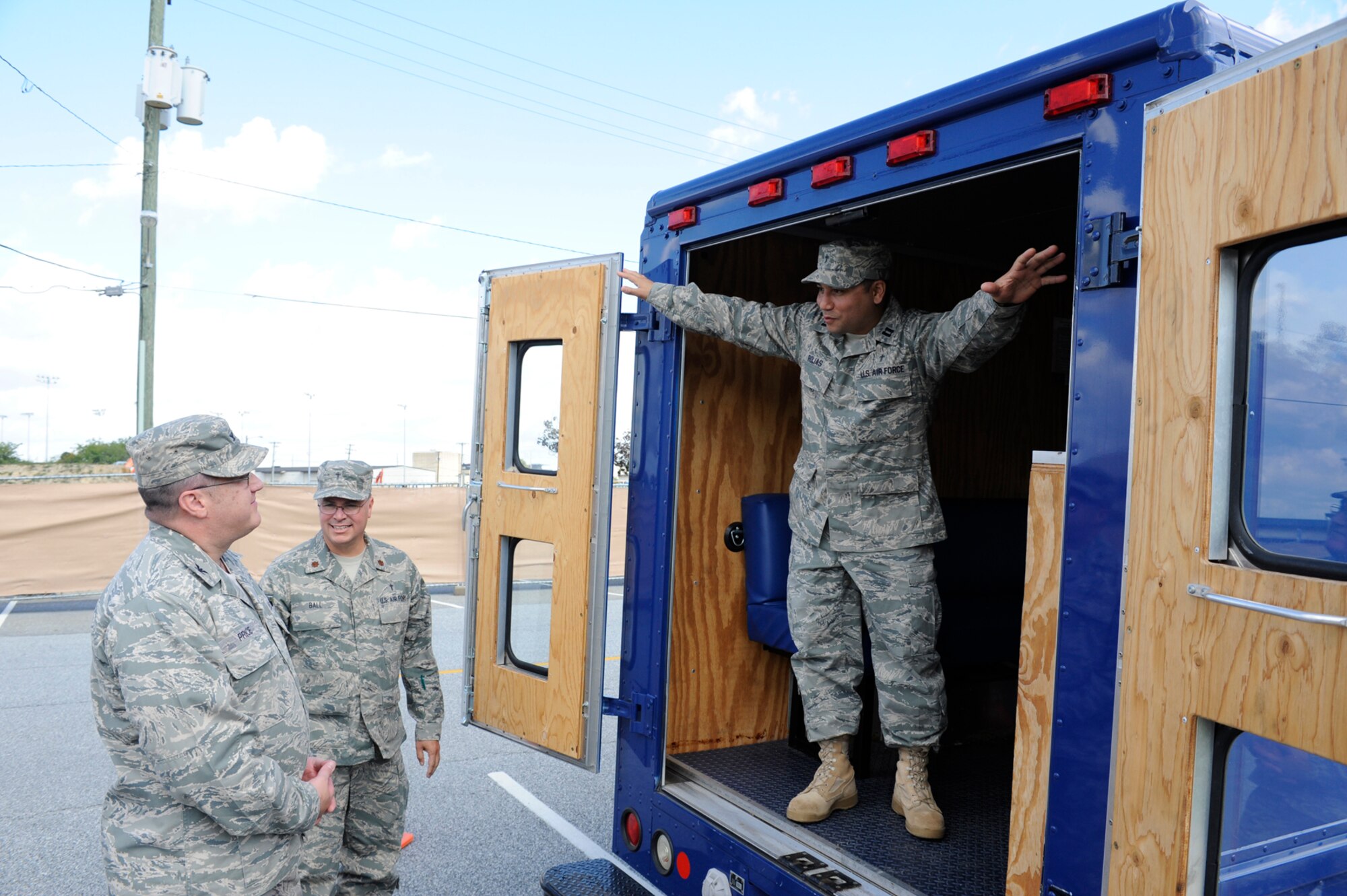 (Left) Col. Arthur Price, Air Mobility Command Installation Excellence Selection Board team member, listens as Chaplain (Maj.) Barry Ball, 512th Airlift Wing, and Chaplain (Capt.) Richard Rojas, 436th Airlift Wing, give him a briefing on the “Holy Roller” Oct. 7.  Dover Air Force Base is competing against Little Rock AFB, Ark., and Charleston AFB, S.C., at the AMC-level of the Commander in Chief’s Annual Award for Installation Excellence for $100,000 in quality of life funding and a chance to compete at the Air Force level. (U.S. Air Force photo by John Sidoriak)